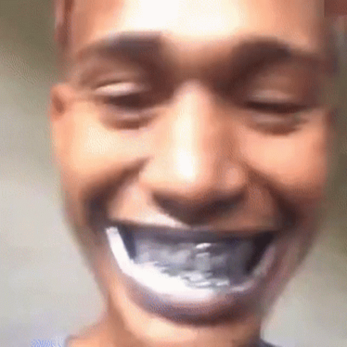 A Close Up Of A Person 'S Face With Their Mouth Open And A Toothbrush In It . GIF