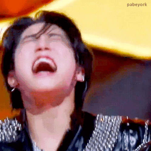 A Close Up Of A Person 'S Face With Their Mouth Open And Their Eyes Closed . GIF