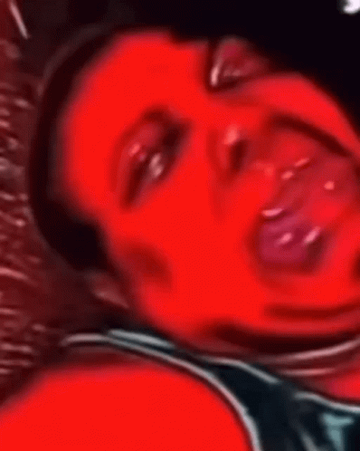 A Close Up Of A Person 'S Face With Their Mouth Open GIF