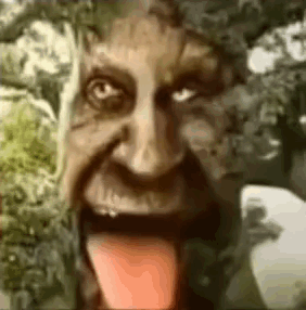 A Close Up Of A Person 'S Face With Their Tongue Hanging Out . GIF