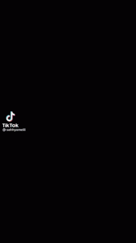 A Close Up Of A Person 'S Face With Tiktok Written On The Bottom Right GIF