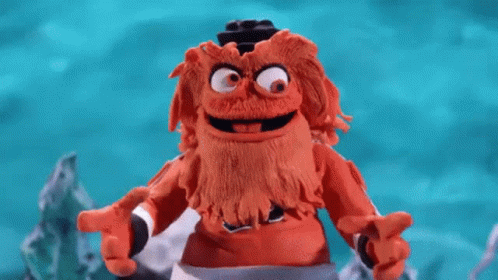 A Close Up Of A Person 'S Feet Wearing A Pair Of Black And Orange Shoes . GIF