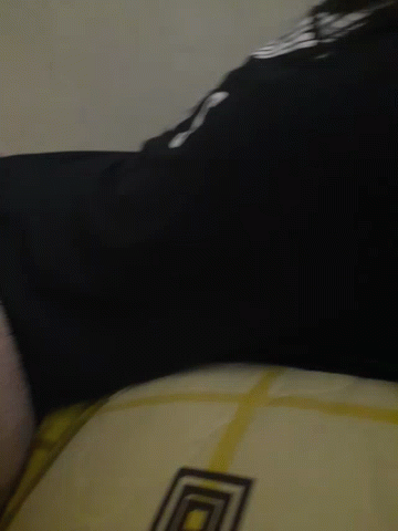 A Close Up Of A Person 'S Feet With A Black Shirt That Says ' Lg ' On It GIF