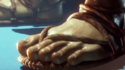 A Close Up Of A Person 'S Feet With Sandals On GIF