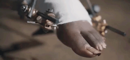 A Close Up Of A Person 'S Foot With A Bandage On It . GIF