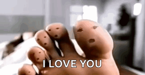 A Close Up Of A Person 'S Foot With Holes In It And The Words `` I Love You '' . GIF