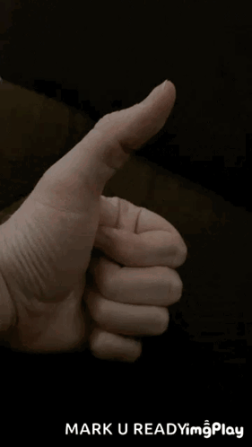 A Close Up Of A Person 'S Hand Giving A Thumbs Up With The Words Mark U Readyim Play Below It GIF