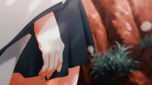 A Close Up Of A Person 'S Hand Holding A Piece Of Paper GIF