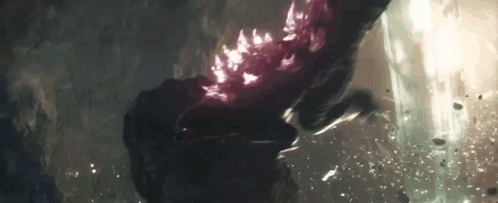 A Close Up Of A Person 'S Hand Holding A Purple Object . GIF