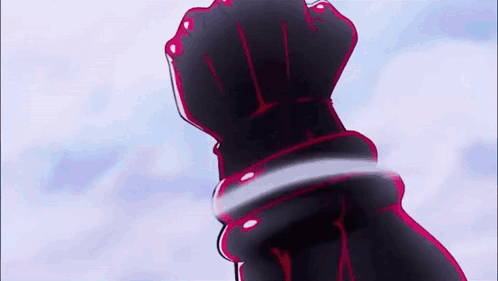A Close Up Of A Person 'S Hand Holding A Sword In The Air . GIF