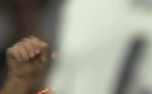 A Close Up Of A Person 'S Hand Holding Something In Their Hand . GIF