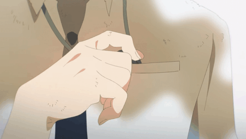 A Close Up Of A Person 'S Hand On A Shirt GIF