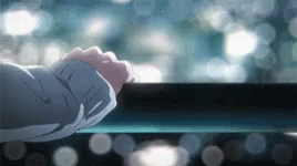 A Close Up Of A Person 'S Hand Reaching Out To Touch A Railing . GIF