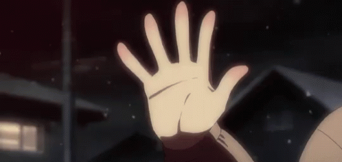 A Close Up Of A Person 'S Hand Reaching Out Towards The Camera . GIF