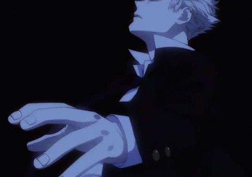 A Close Up Of A Person 'S Hand With A Black Suit GIF