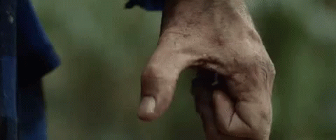 A Close Up Of A Person 'S Hand With A Dirty Thumb Pointing At Something . GIF