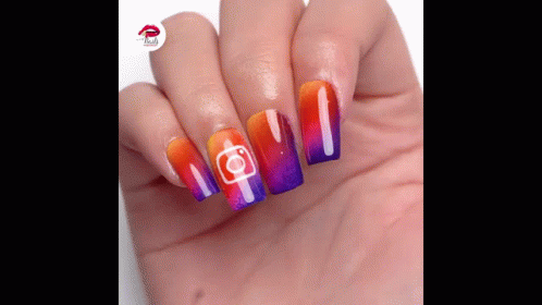 A Close Up Of A Person 'S Hand With Colorful Nails And A Instagram Logo On Them GIF