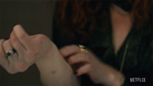 A Close Up Of A Person 'S Hand With Netflix Written On The Bottom Right GIF