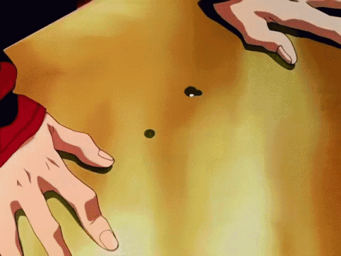 A Close Up Of A Person 'S Hands On A Table With A Green Ball On It GIF