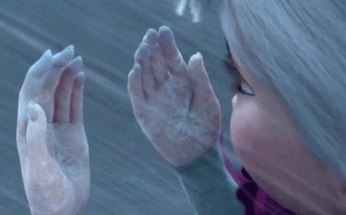 A Close Up Of A Person 'S Hands With Snow On Them . GIF