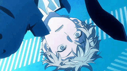 A Close Up Of A Person 'S Head With A Blue Background . GIF