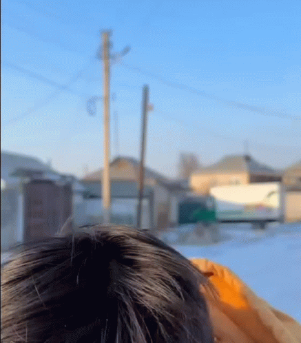 A Close Up Of A Person 'S Head With A Blurred Background GIF