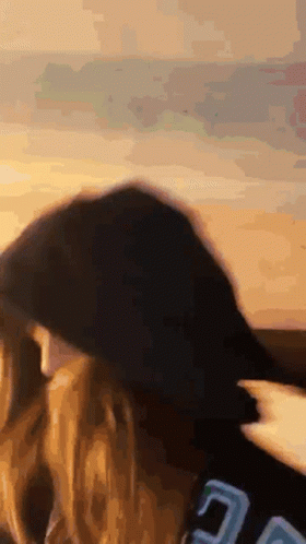 a close up of a person 's head with a blurred background