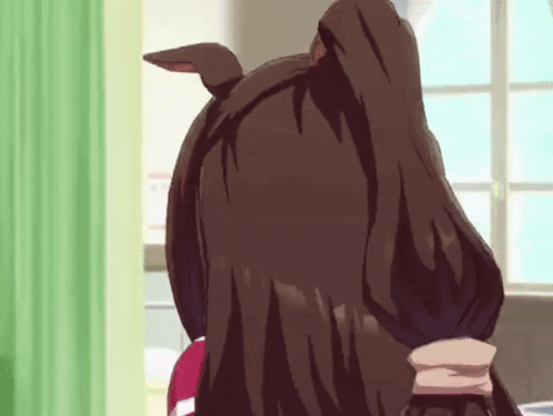 A Close Up Of A Person 'S Head With A Green Curtain In The Background GIF