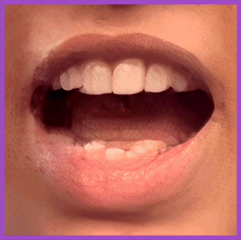 A Close Up Of A Person 'S Mouth And Teeth GIF