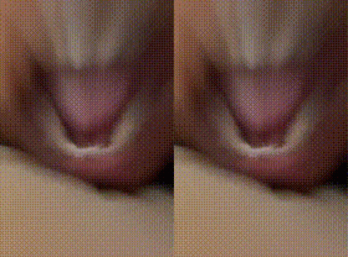 A Close Up Of A Person 'S Mouth And Tongue With A Polka Dot Background . GIF
