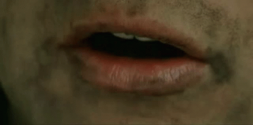 A Close Up Of A Person 'S Mouth With Red Lipstick And A Dirty Face . GIF