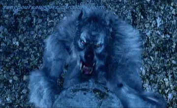 A Close Up Of A Person 'S Mouth With Teeth Coming Out Of It 'S Mouth . GIF