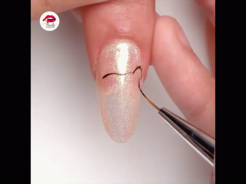 A Close Up Of A Person 'S Nails With The Word Nails On The Bottom Right GIF