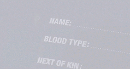 a close up of a person 's name , blood type , and next of kin .