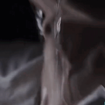A Close Up Of A Person 'S Neck And Chest With Water Dripping From It . GIF