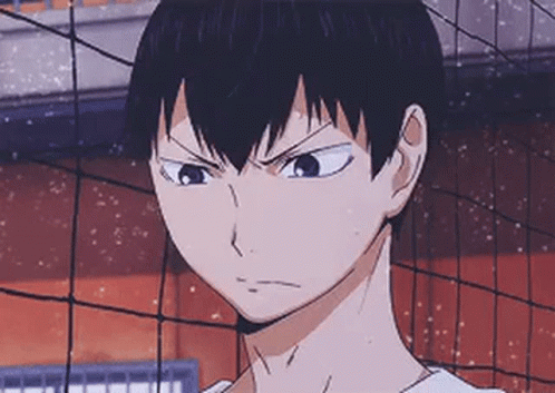 A Close Up Of A Person Standing In Front Of A Volleyball Net With A Serious Look On Their Face . GIF