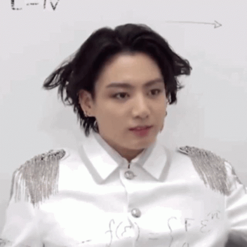 A Close Up Of A Person Standing In Front Of A White Board With A Formula Written On It . GIF