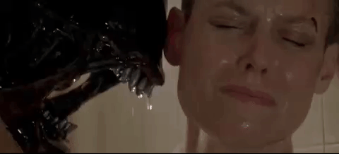A Close Up Of A Person Taking A Bath With A Monster Coming Out Of Their Mouth . GIF