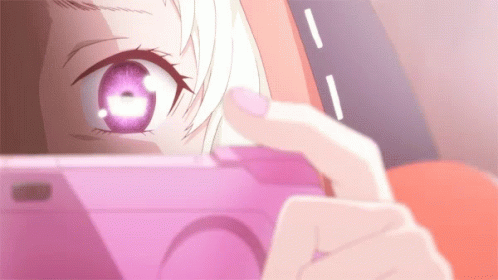 A Close Up Of A Person Taking A Picture With A Pink Phone GIF