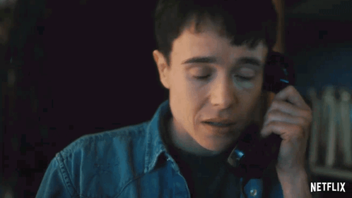 A Close Up Of A Person Talking On A Telephone With Netflix Written On The Bottom GIF