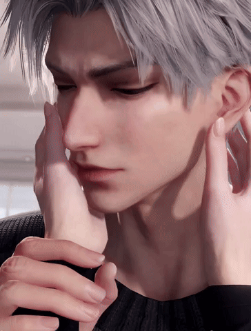 A Close Up Of A Person Touching A Man 'S Face With Their Hand GIF