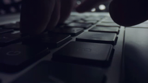 A Close Up Of A Person Typing On A Keyboard With The H Key GIF