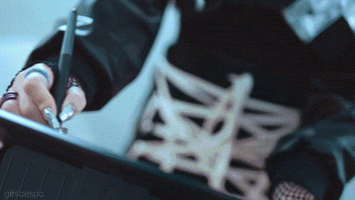 a close up of a person using a pen on a tablet with a gifscaespa watermark