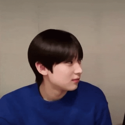 A Close Up Of A Person Wearing A Blue Sweater GIF