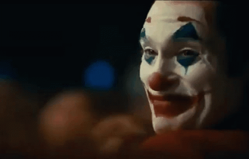 Person In Clown Mask With Blood On Face GIF