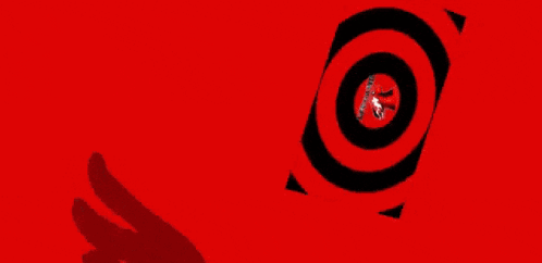 A Close Up Of A Person Wearing A Clown Mask With Red Eyes . GIF