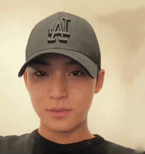 A Close Up Of A Person Wearing A Hat . GIF