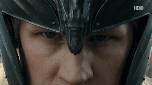 a close up of a person wearing a helmet with hbo written on the bottom