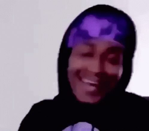 A Close Up Of A Person Wearing A Hoodie And A Purple Bandana . GIF
