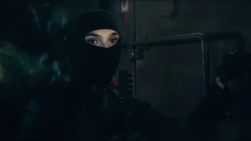 A Close Up Of A Person Wearing A Mask GIF
